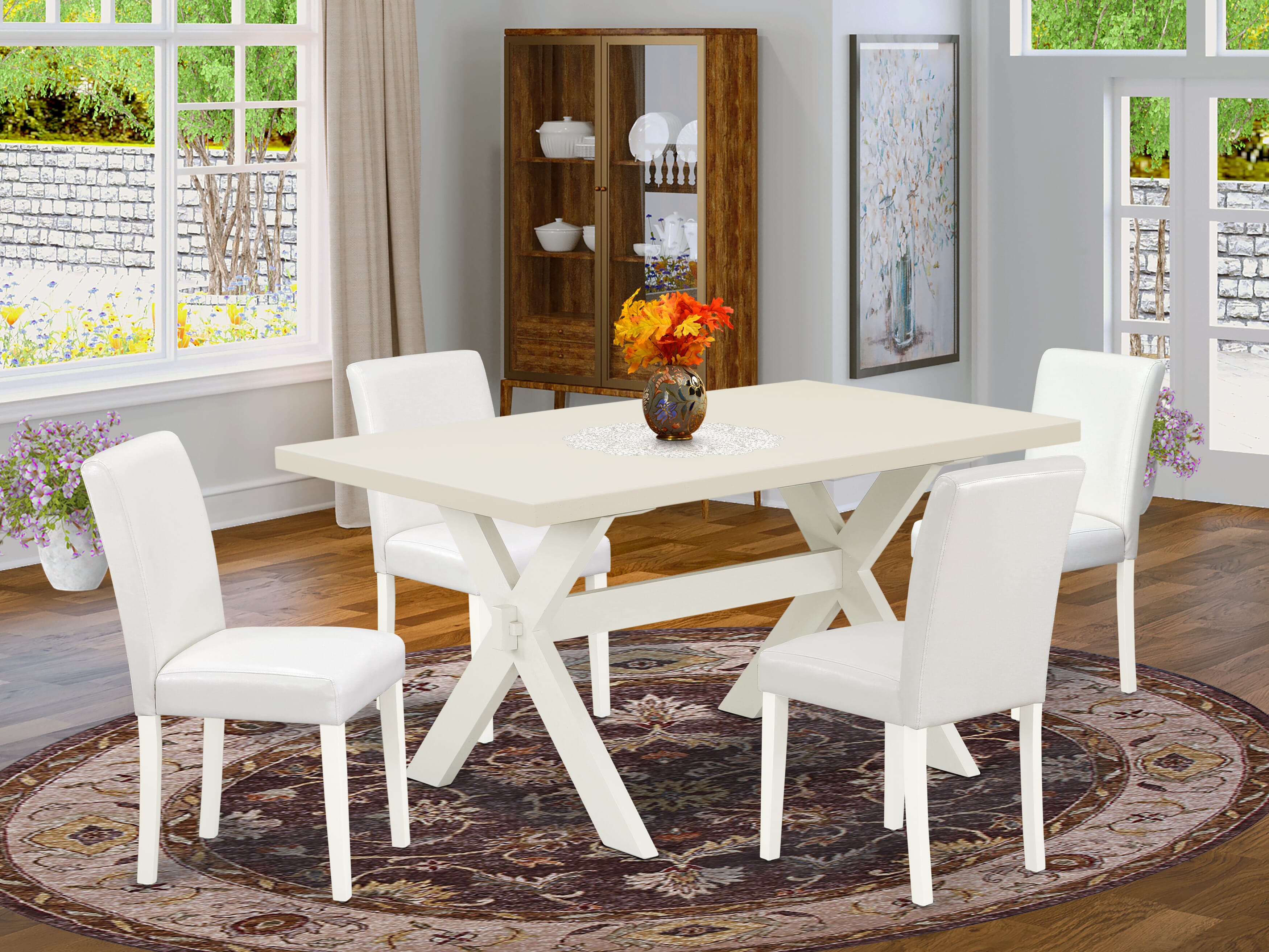 Juego de comedor de 5 piezas East West Furniture X026AB264-5. Incluye una mesa de comedor rectangular con patas en forma de X y 4 sillas Parson tapizadas en piel sintética blanca.