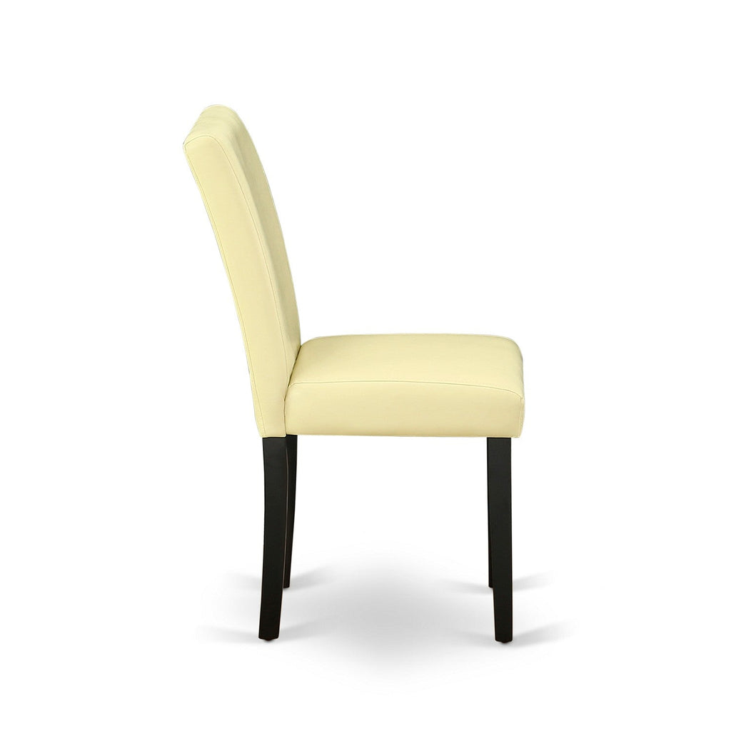 El juego de comedor de 5 piezas East West Furniture LGAB5-BLK-73 incluye una mesa de comedor rectangular con diseño de hojas de mariposa y 4 sillas Parson tapizadas en piel sintética color ponche de huevo.