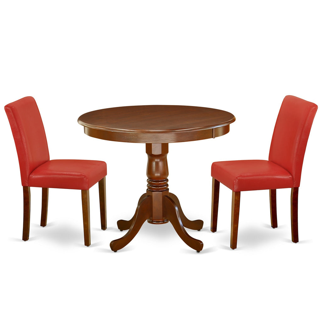 Juego de comedor de 3 piezas ANAB3-MAH-72 de East West Furniture para espacios pequeños. Incluye una mesa de cocina redonda con pedestal y dos sillas Parsons de cuero sintético rojo ladrillo refractario.