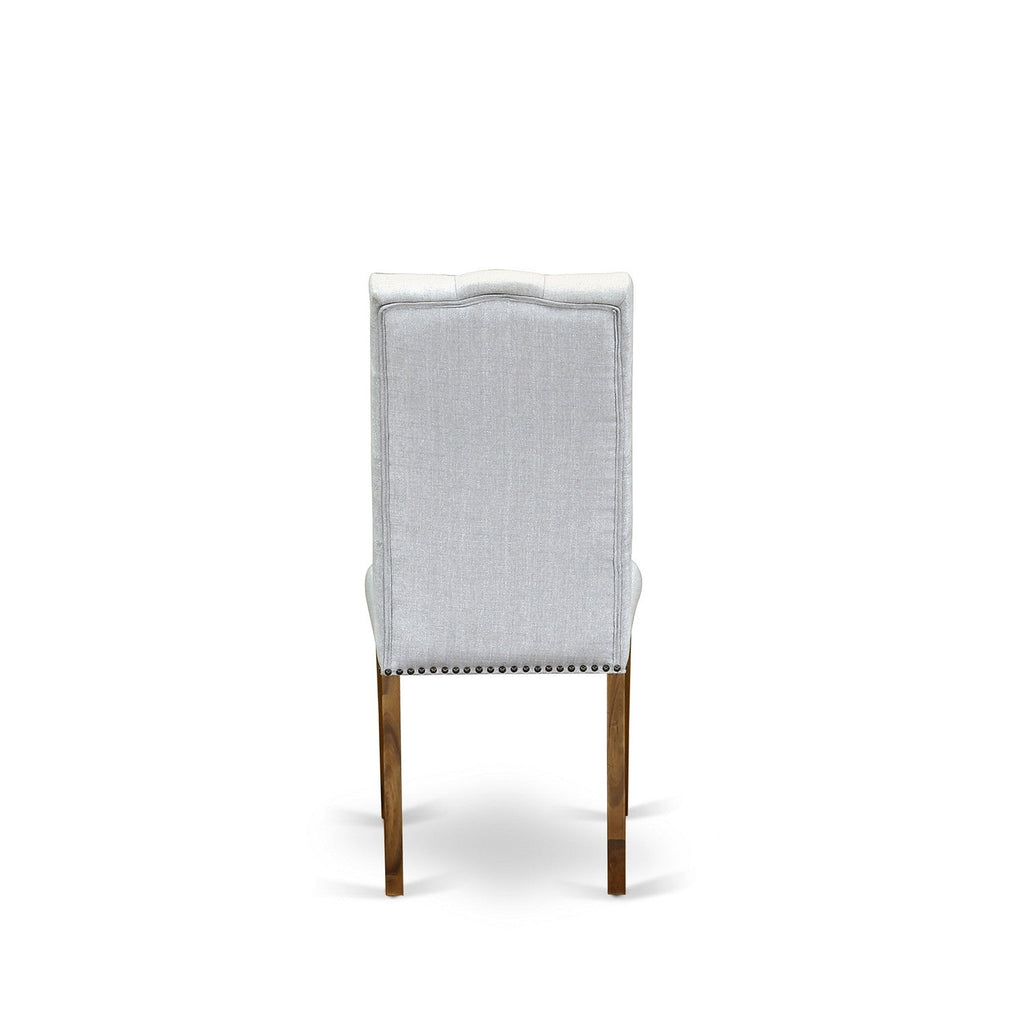 Juego de comedor East West Furniture LAEN11-71-20 de 11 piezas. Incluye una mesa de comedor rectangular con diseño de hojas de mariposa y 10 sillas tapizadas en tela de lino Gotham oscuro.