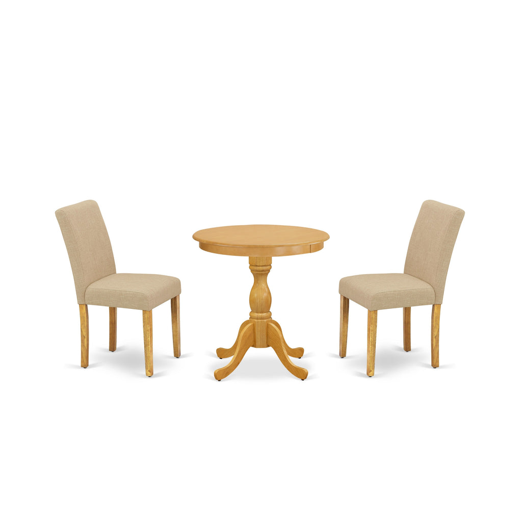 Juego de mesa de comedor de 3 piezas ESAB3-OAK-04 de East West Furniture para espacios pequeños. Contiene una mesa redonda de madera con pedestal y 2 sillas Parson de tela de lino color tostado claro.