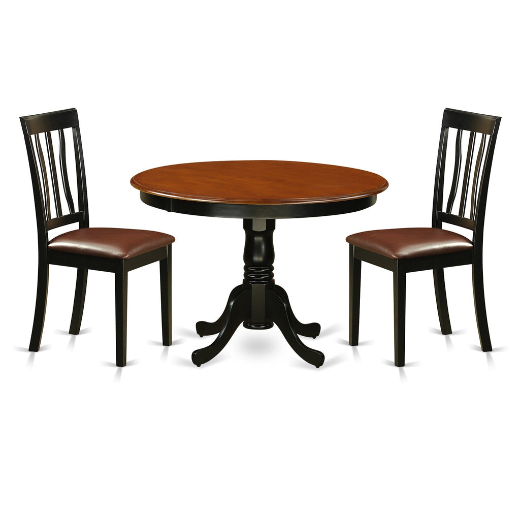 Juego de mesa de comedor de 3 piezas East West Furniture HLAN3-BCH-LC. Incluye una mesa de cocina redonda con pedestal y 2 sillas de comedor tapizadas en piel sintética.