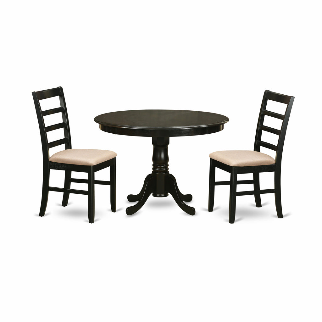 Juego de comedor de 3 piezas East West Furniture HLPF3-CAP-C. Incluye una mesa de cocina redonda con pedestal y dos sillas de comedor tapizadas en tela de lino.