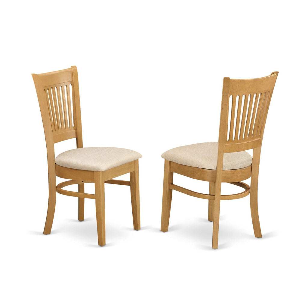 El juego de mesa de comedor moderno de 5 piezas East West Furniture AVVA5-OAK-C incluye una mesa ovalada de madera con hojas de mariposa y 4 sillas de comedor de cocina de tela de lino.